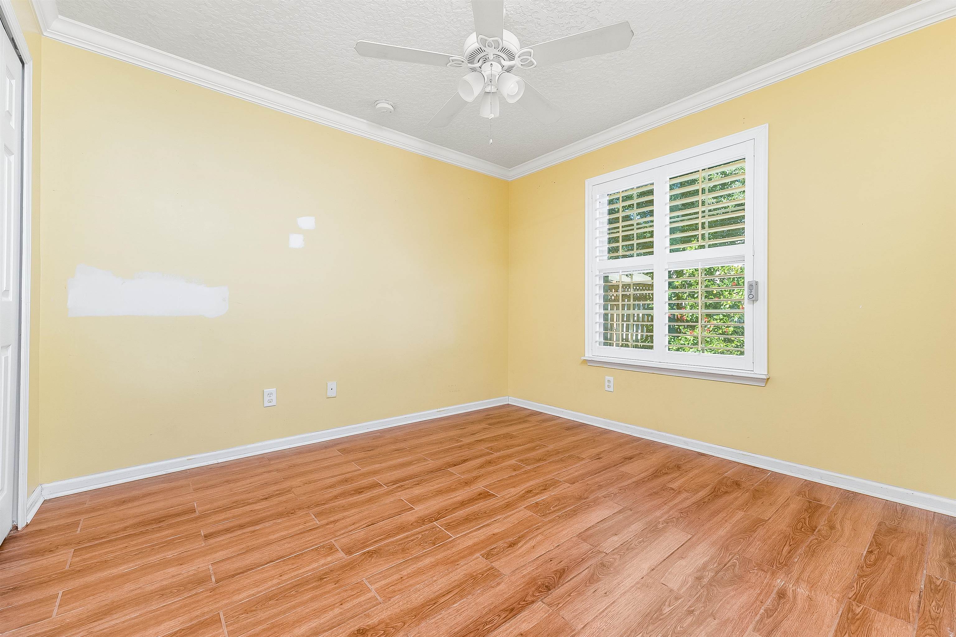 1236 Splendid Ravine Street St. Augustine, FL 32092 - Photo 37 of 47 wooden floor in an empty room with a window