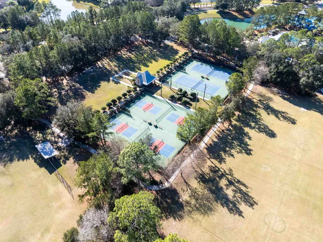 an aerial view of residential houses with outdoor space