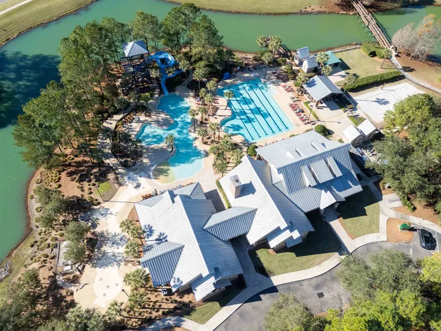an aerial view of a house with a yard and garden