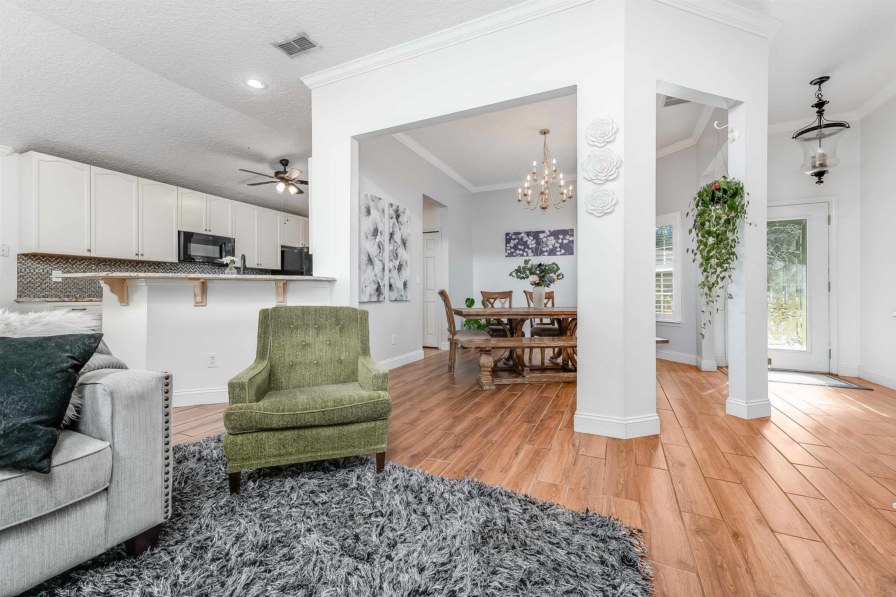 1236 Splendid Ravine Street St. Augustine, FL 32092 - Photo 6 of 47 a living room with furniture and a wooden floor