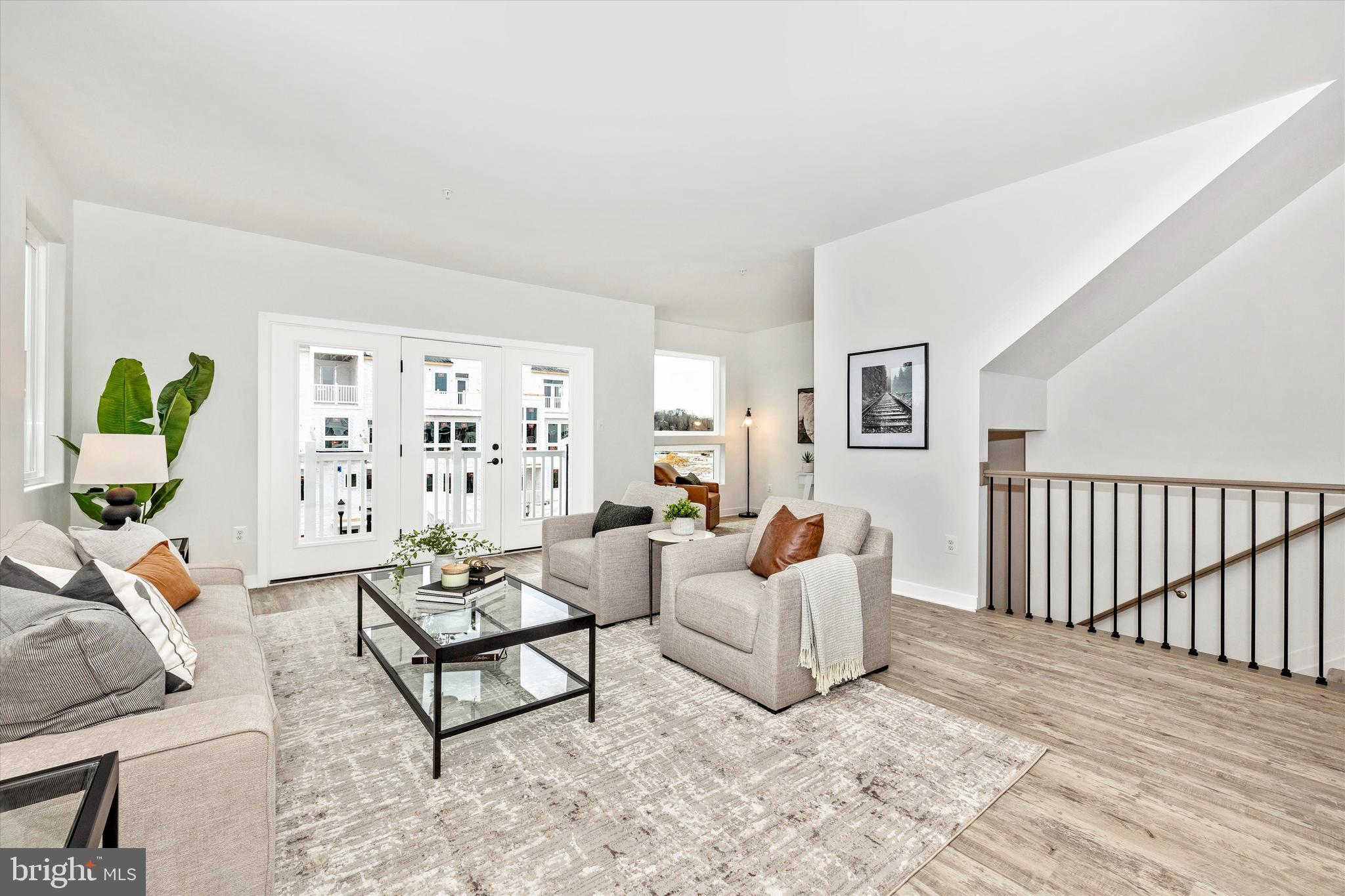 709 Iron Frg Road, Unit B Frederick, MD 21702 - Photo 13 of 32 a living room with furniture and wooden floor