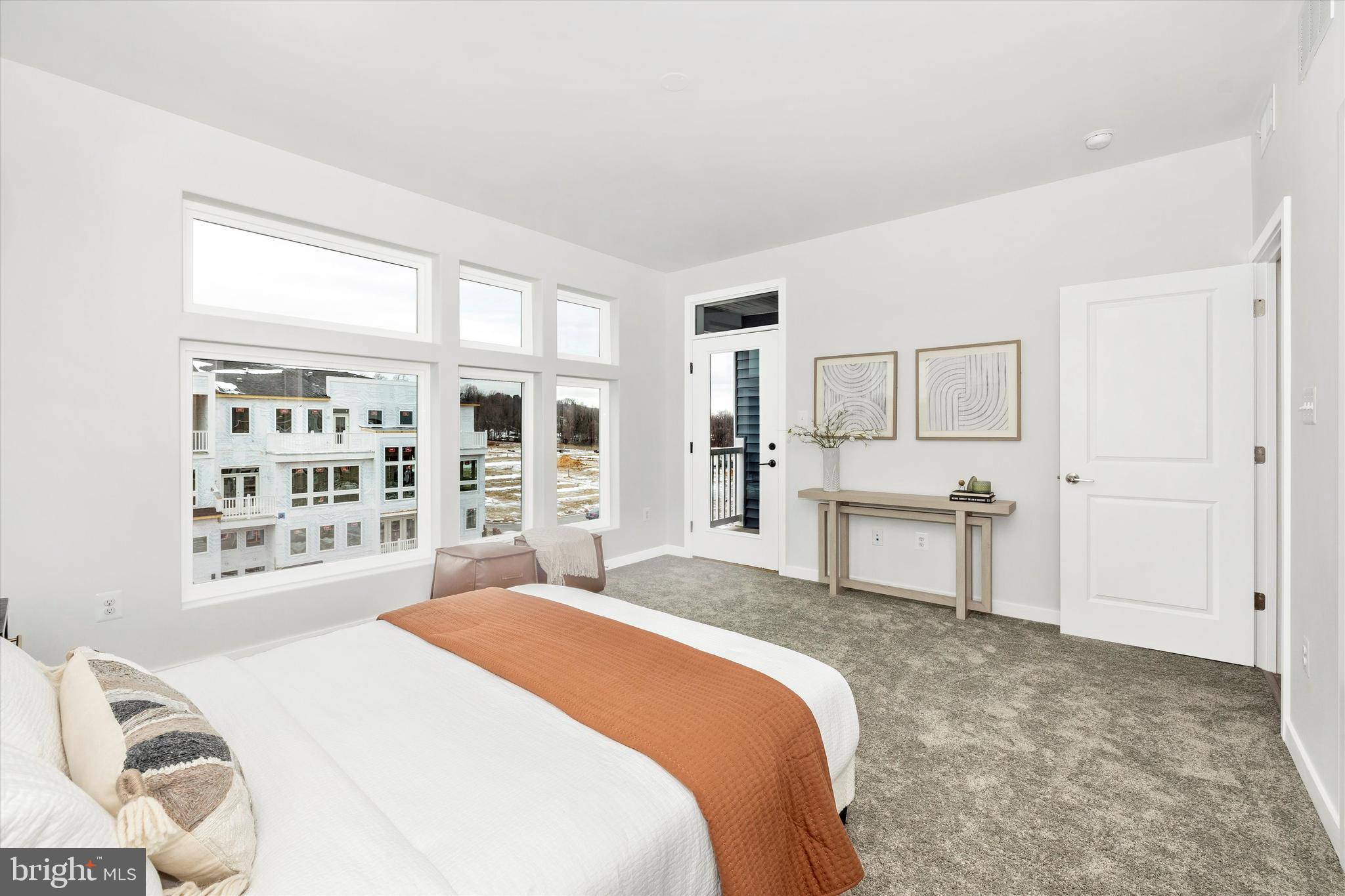 709 Iron Frg Road, Unit B Frederick, MD 21702 - Photo 23 of 32 a spacious bedroom with a bed and a cabinets