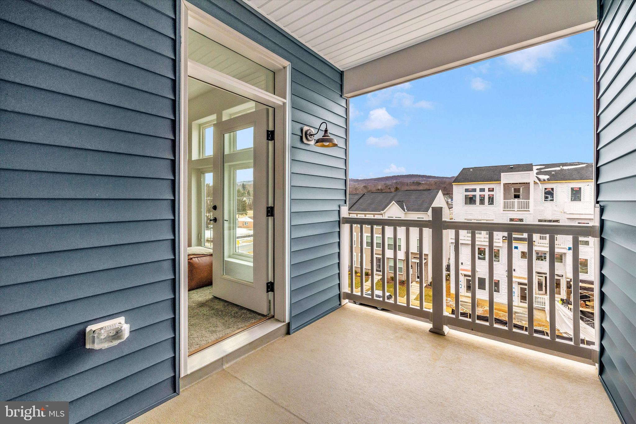 709 Iron Frg Road, Unit B Frederick, MD 21702 - Photo 25 of 32 a view of a balcony with door and wooden walls