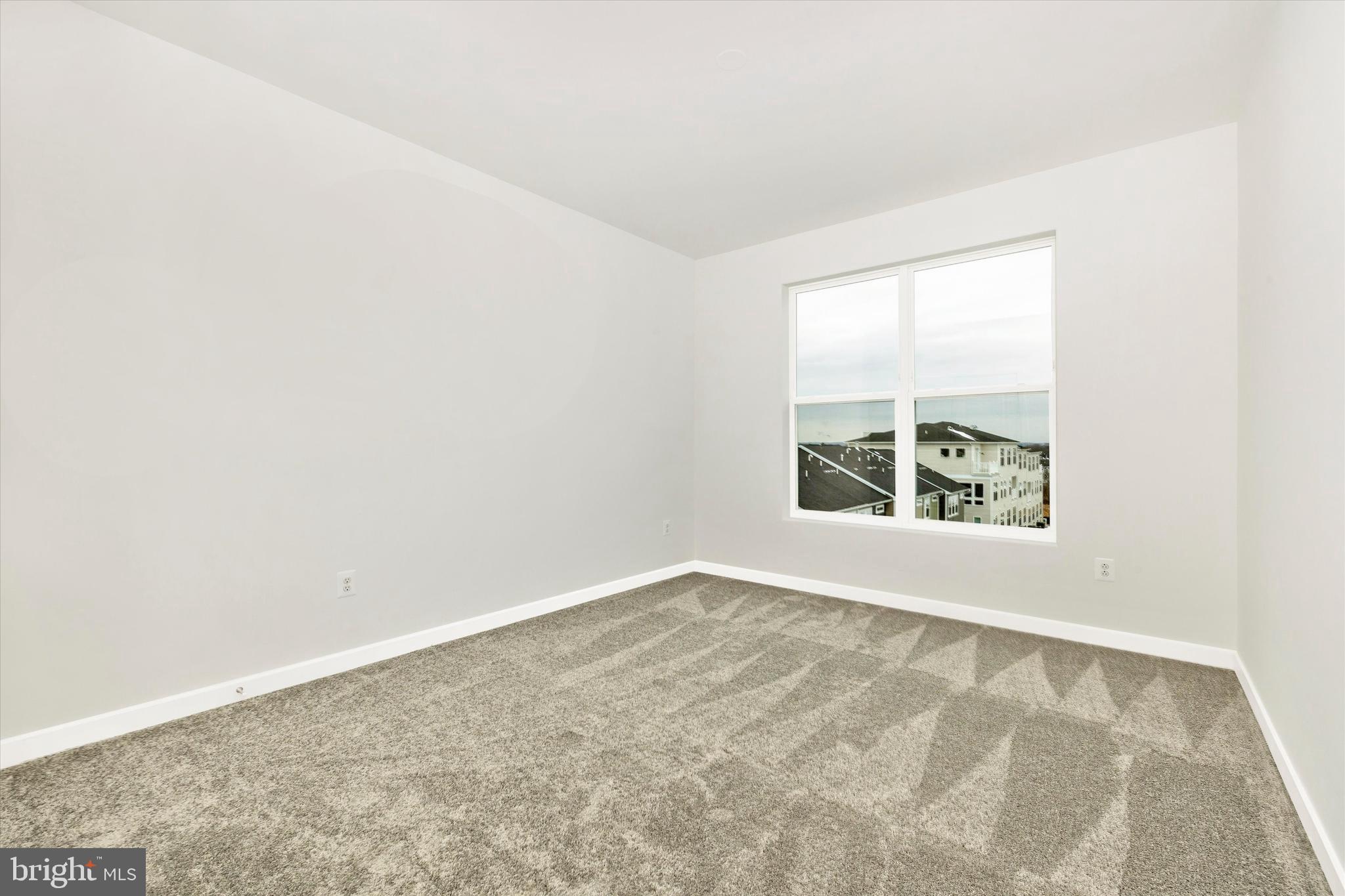 709 Iron Frg Road, Unit B Frederick, MD 21702 - Photo 27 of 32 an empty room with windows