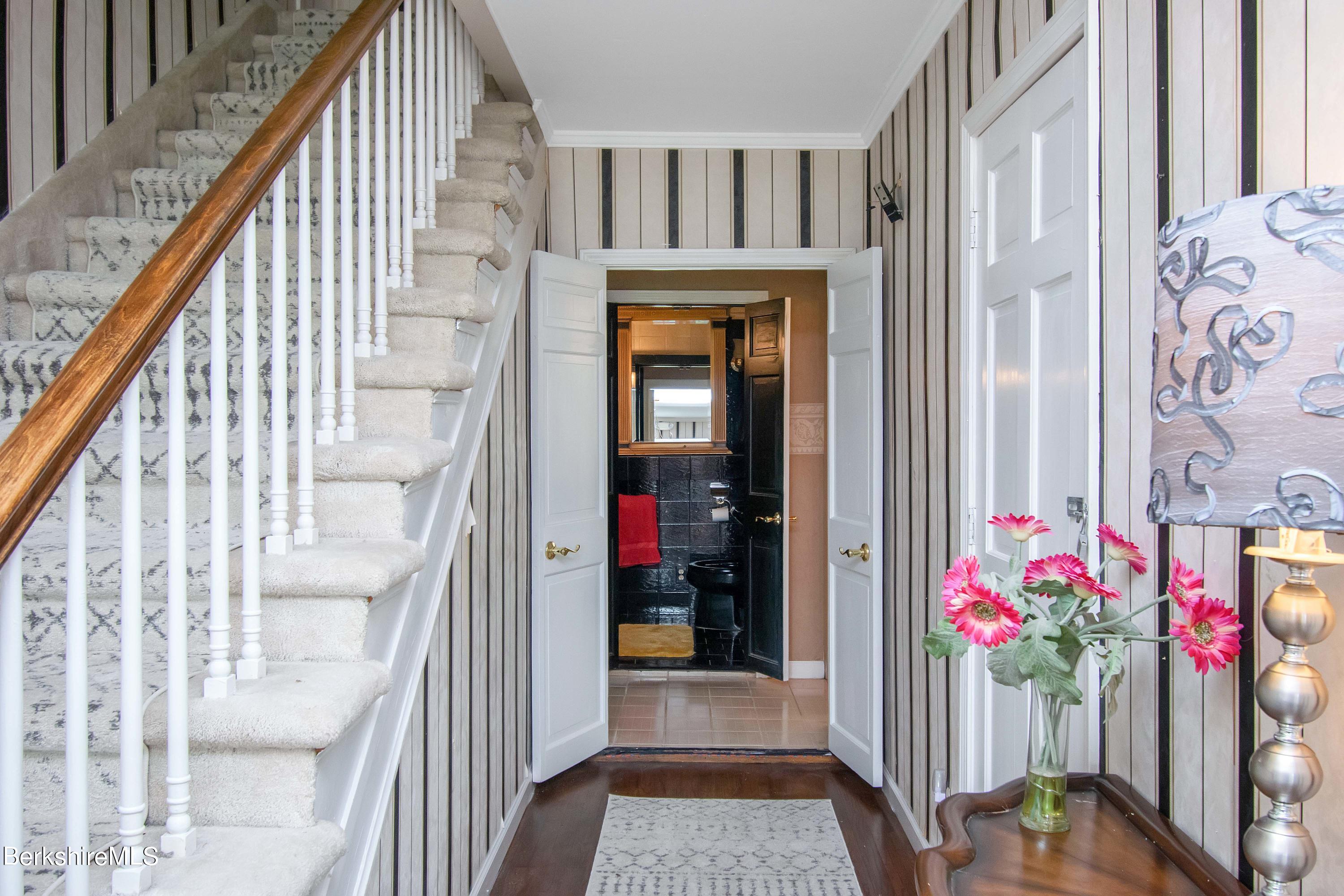 665 Middle Road Clarksburg, MA 01247 - Photo 14 of 36 a view of a hallway with wooden floor and stairs