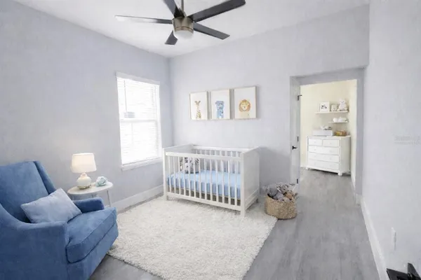 a bedroom with furniture and a window