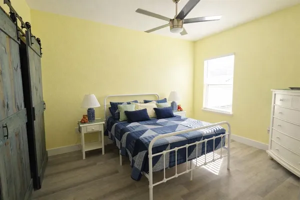 a bedroom with a bed and a closet