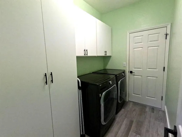 a utility room with washer and dryer