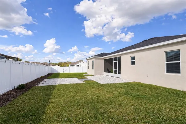 a view of a backyard of the house