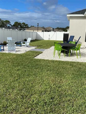 a view of a swimming pool with a yard