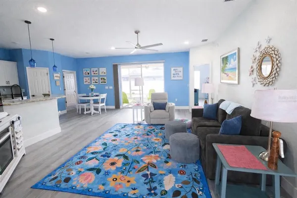 a living room with furniture and a rug