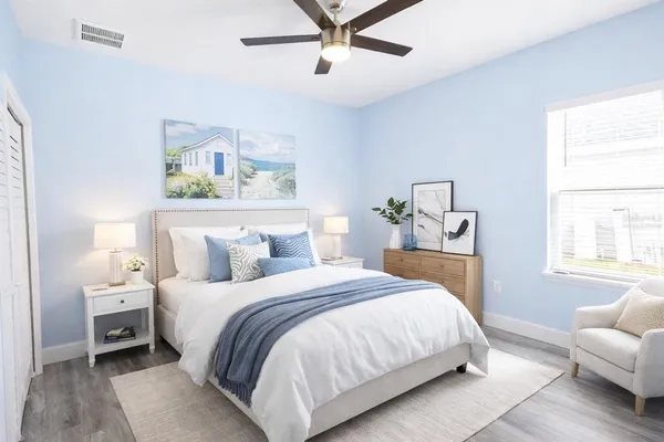 a bedroom with a bed and a couch