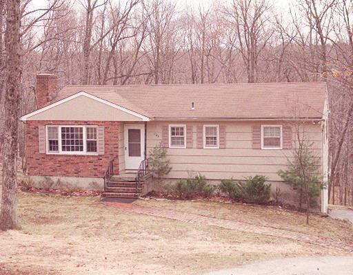 126 Stony Hill Road Ridgefield, CT 06877 - Photo 1 of 1 a front view of a house with yard covered in snow