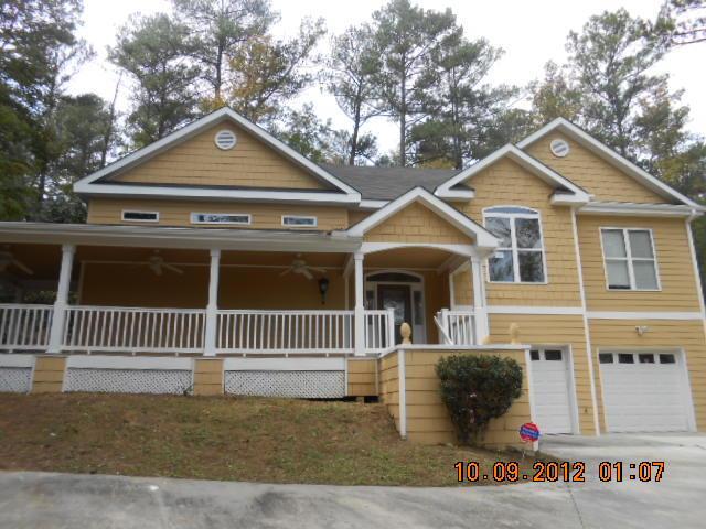 2312 Carr Road Northeast Conyers, GA 30012 - Photo 1 of 1 a front view of a house with a yard