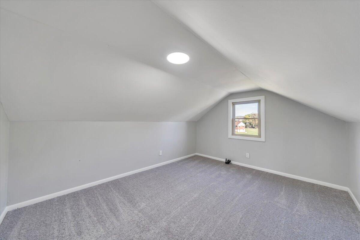 210 Post Road Roanoke, VA 24019 - Photo 21 of 56 a view of an empty room with a window