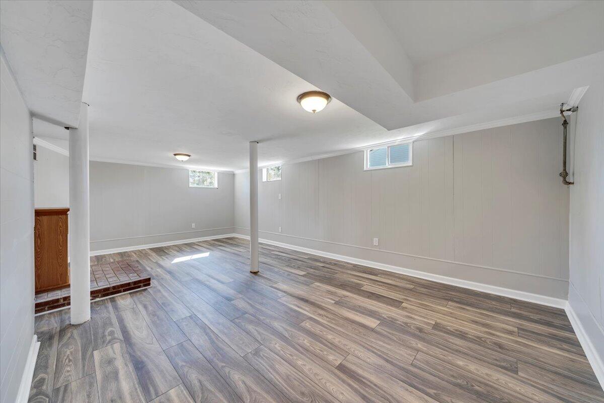 210 Post Road Roanoke, VA 24019 - Photo 22 of 56 wooden floor in an empty room with a window