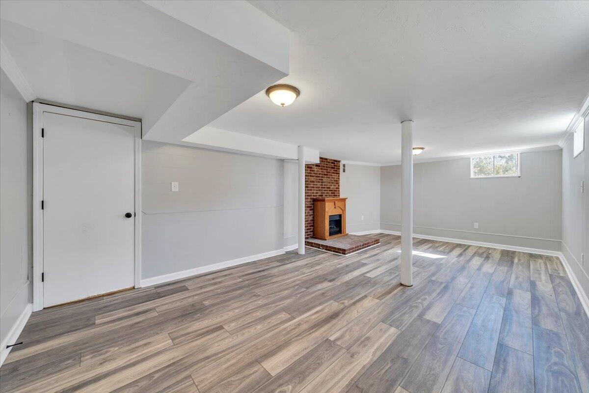 210 Post Road Roanoke, VA 24019 - Photo 23 of 56 wooden floor in an empty room with a window