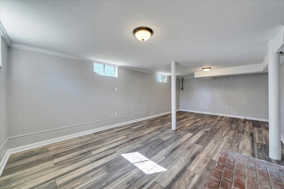 210 Post Road Roanoke, VA 24019 - Photo 26 of 56 a view of an empty room with wooden floor and a window