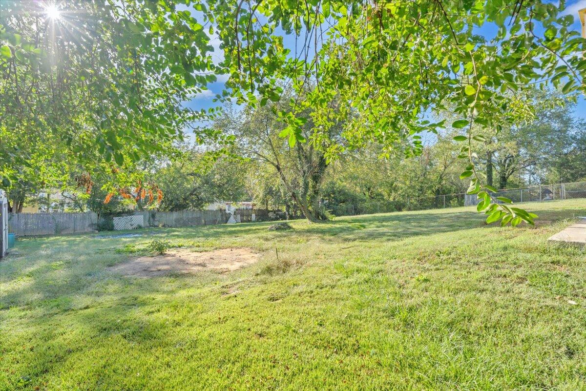 210 Post Road Roanoke, VA 24019 - Photo 43 of 56 a backyard of a house with lots of green space