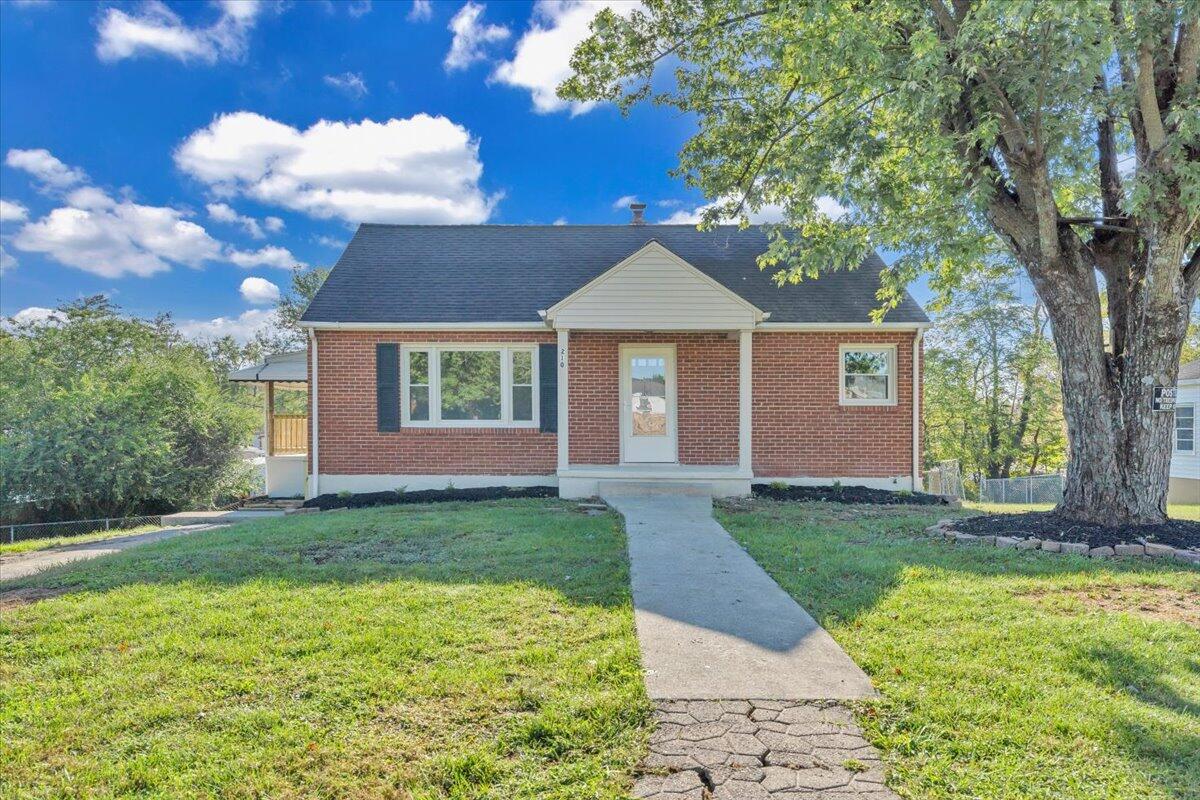 210 Post Road Roanoke, VA 24019 - Photo 56 of 56 a view of a yard in front of a house with large windows