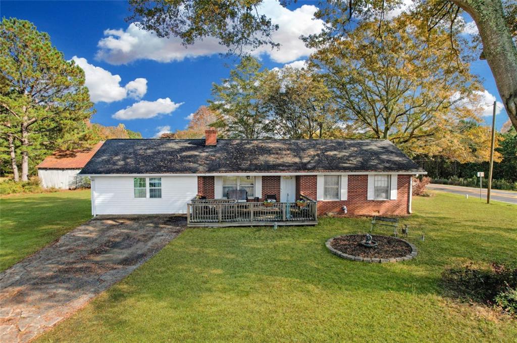 a front view of a house with a yard garage and outdoor seating