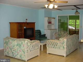 28 Rabbit Run Lane Ocean Pines, MD 21811 - Photo 6 of 7 a living room with furniture and a fireplace