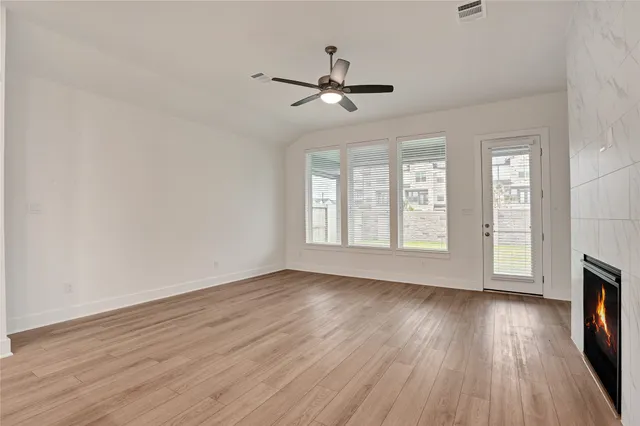 a view of a kitchen with a sink and a window