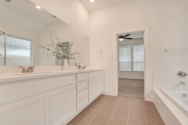 a bathroom with a sink a toilet and bathtub