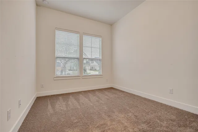 a view of a house with backyard and garden