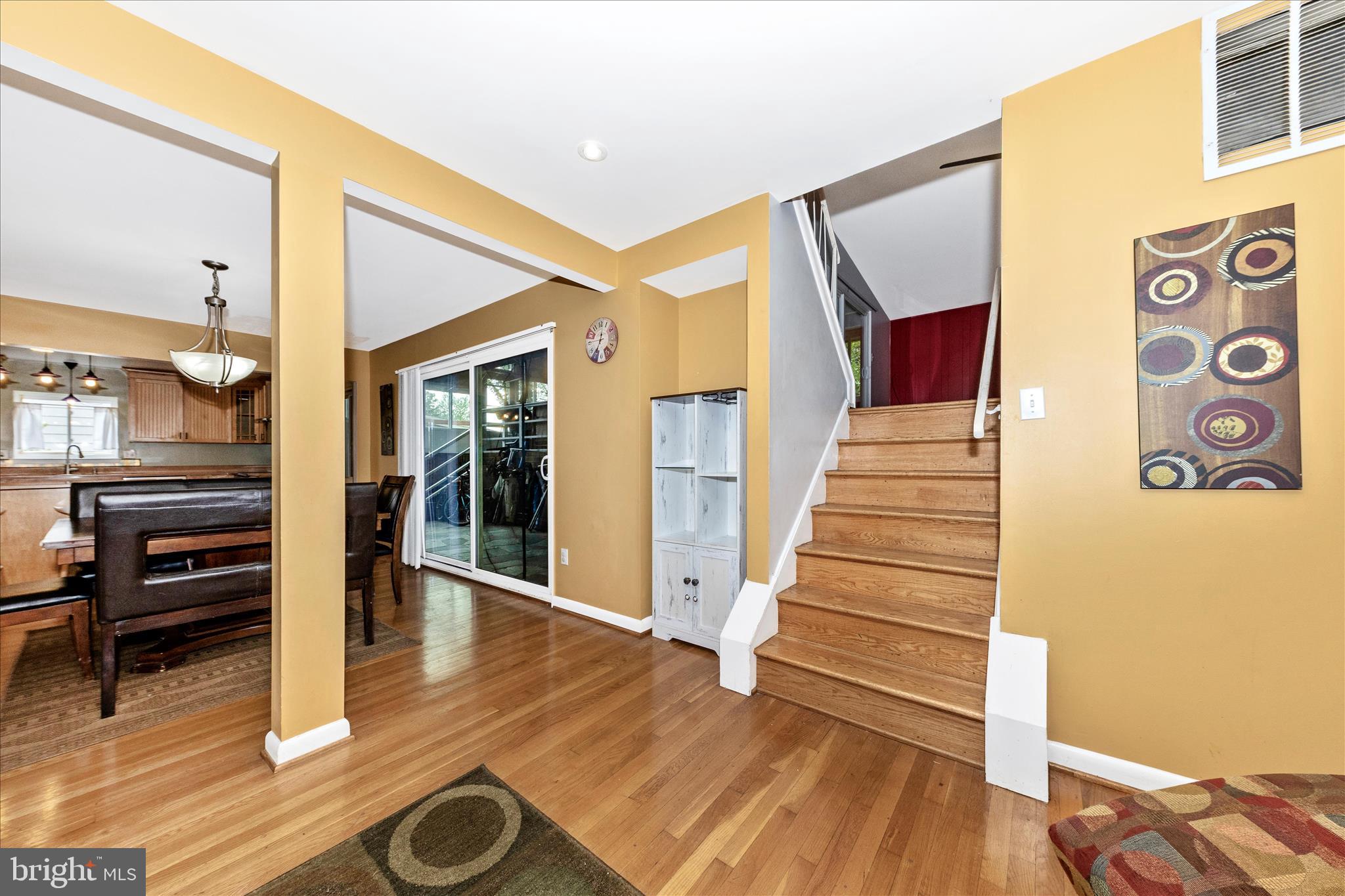 11412 Fairoak Drive Silver Spring, MD 20902 - Photo 16 of 48 a view of a livingroom with wooden floor and stairs