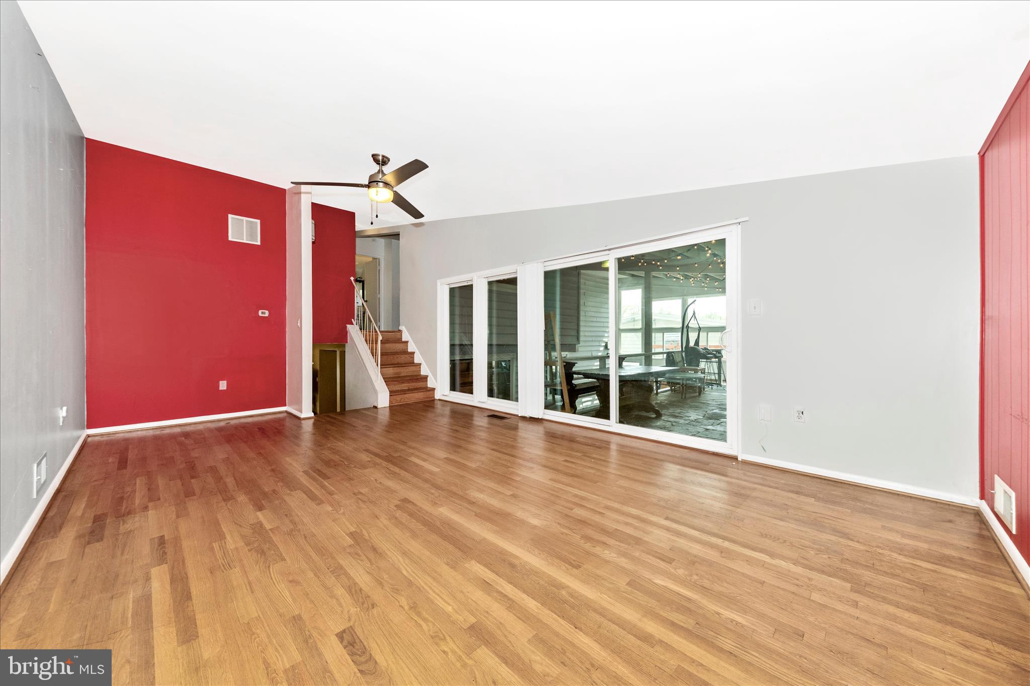 11412 Fairoak Drive Silver Spring, MD 20902 - Photo 18 of 48 a view of an empty room with wooden floor and fan