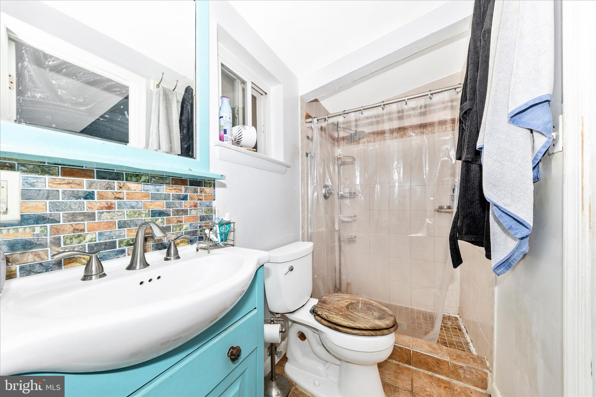 11412 Fairoak Drive Silver Spring, MD 20902 - Photo 23 of 48 a bathroom with a sink toilet and shower