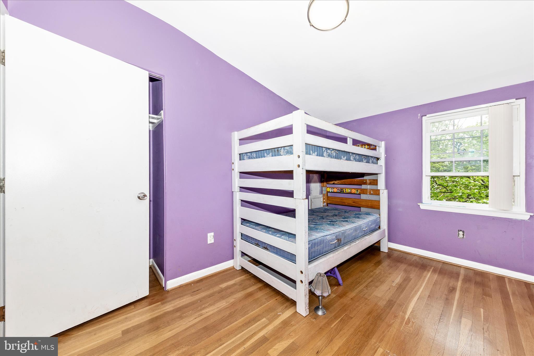 11412 Fairoak Drive Silver Spring, MD 20902 - Photo 24 of 48 a view of an empty room with wooden floor and window