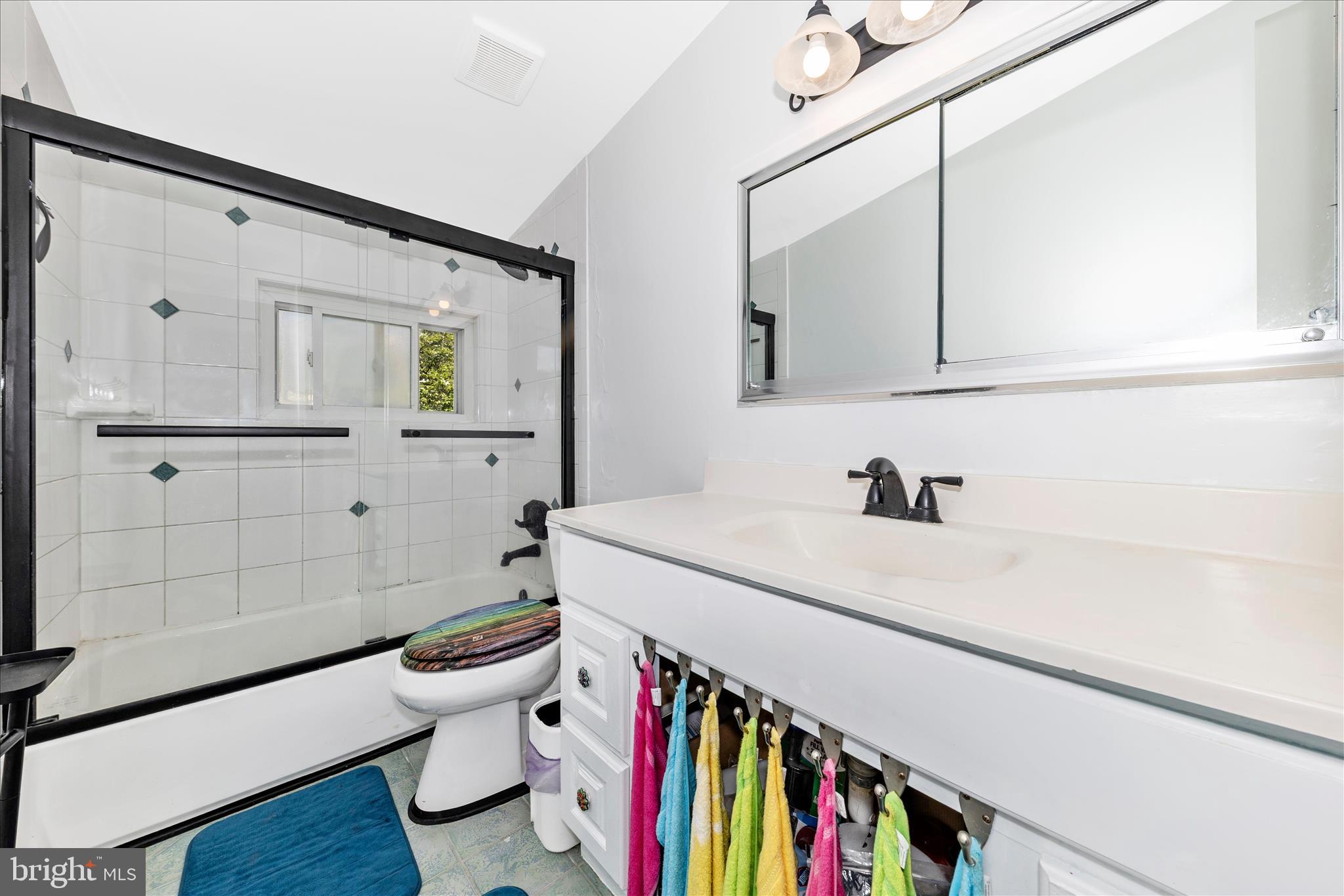 11412 Fairoak Drive Silver Spring, MD 20902 - Photo 29 of 48 a bathroom with a sink a toilet and a mirror