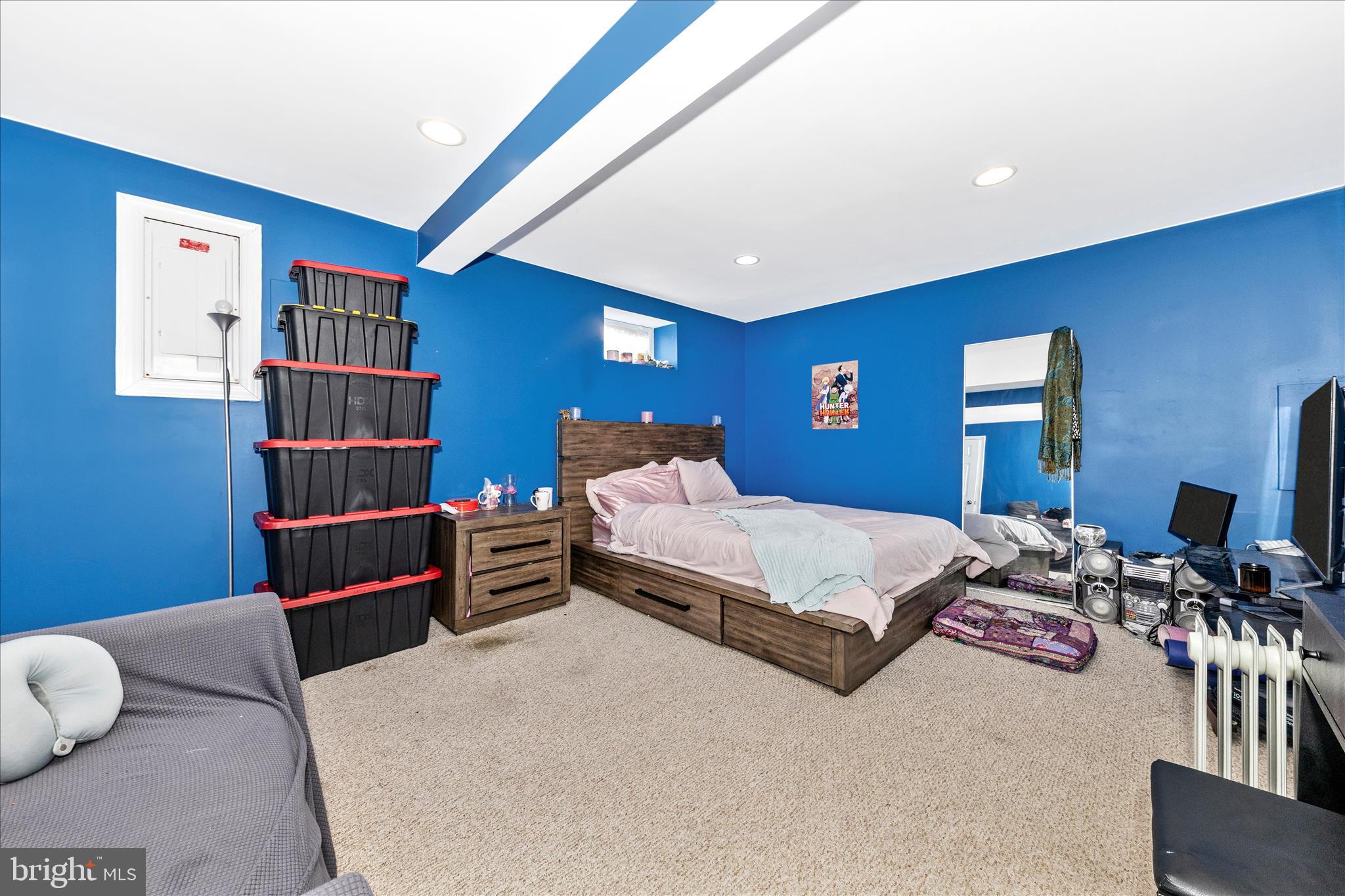 11412 Fairoak Drive Silver Spring, MD 20902 - Photo 35 of 48 a bedroom with a bed and furniture