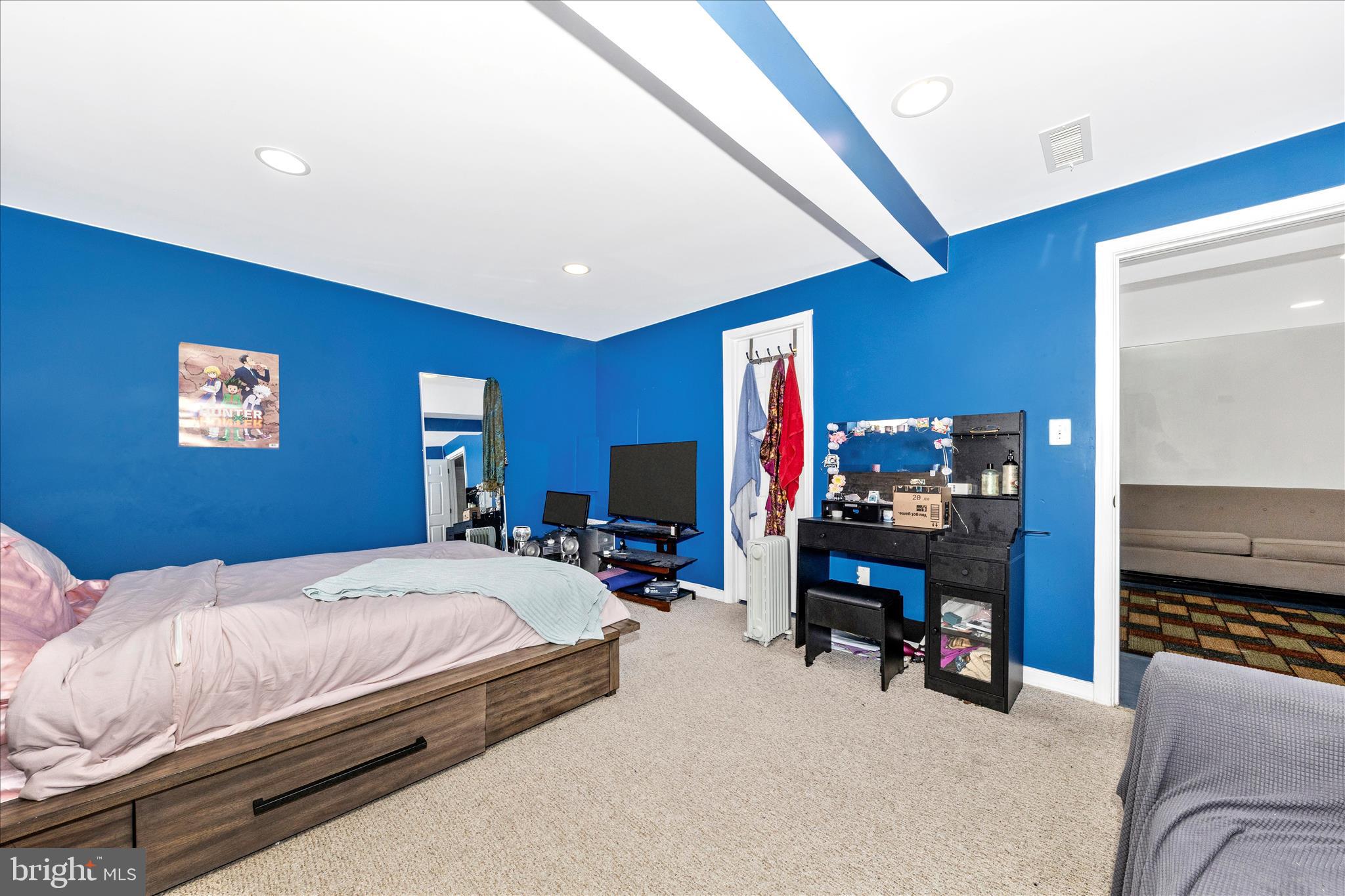11412 Fairoak Drive Silver Spring, MD 20902 - Photo 36 of 48 a bedroom with bed and a chandelier