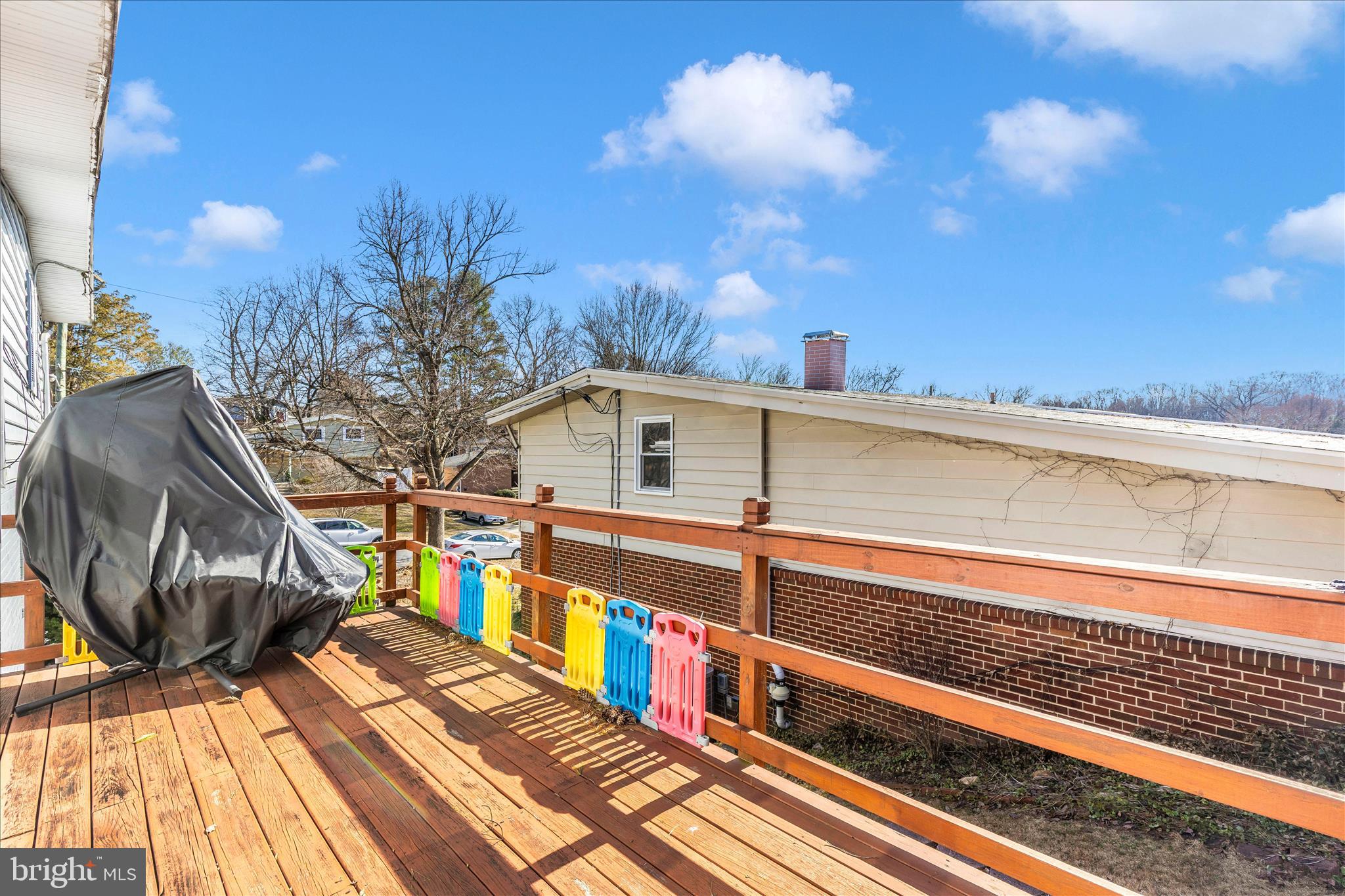 11412 Fairoak Drive Silver Spring, MD 20902 - Photo 42 of 48 a view of a balcony with wooden floor and city view