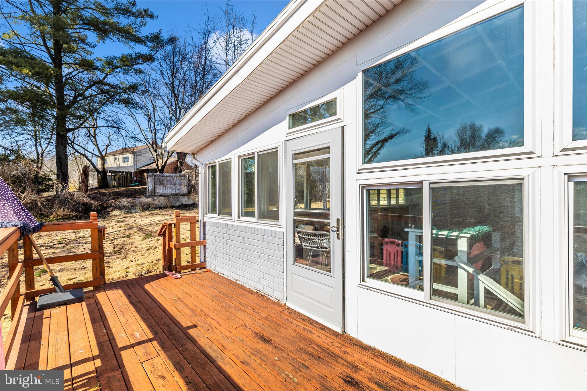 11412 Fairoak Drive Silver Spring, MD 20902 - Photo 43 of 48 a view of a balcony with floor to ceiling windows with wooden floor