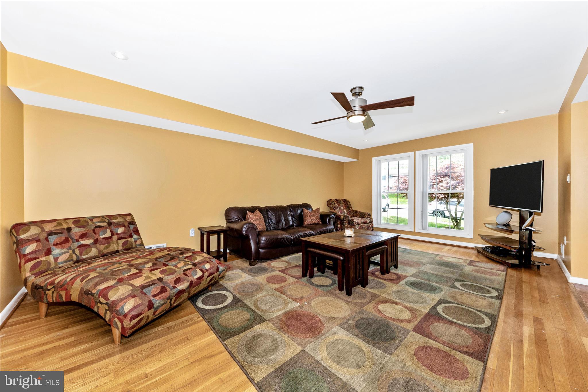 11412 Fairoak Drive Silver Spring, MD 20902 - Photo 6 of 48 a living room with couch tv and a large window