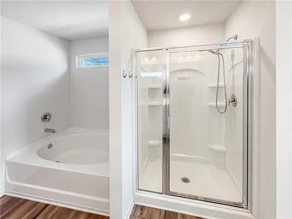 a bathroom with a glass shower door