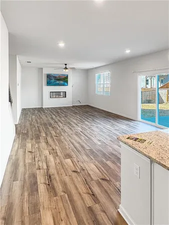 a view of a livingroom with wooden floor