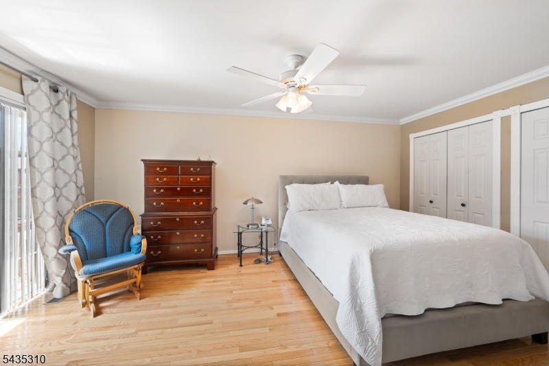 488 Auten Road, Unit 2D Hillsborough, NJ 08844 - Photo 16 of 30 a bedroom with a bed and a chair