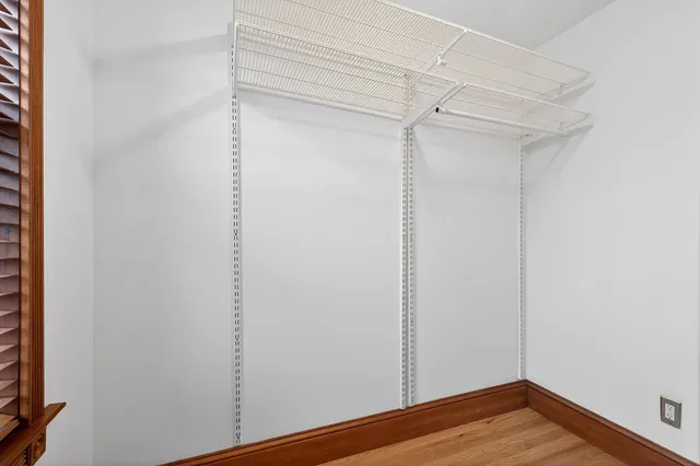 a view of room with wooden floor