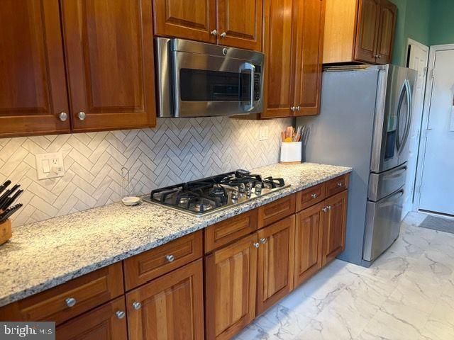 2601 Mill Race Road Frederick, MD 21701 - Photo 14 of 42 a kitchen with stainless steel appliances granite countertop a stove a refrigerator and a microwave