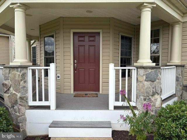 2601 Mill Race Road Frederick, MD 21701 - Photo 2 of 42 front view of a house with a potted plant and windows