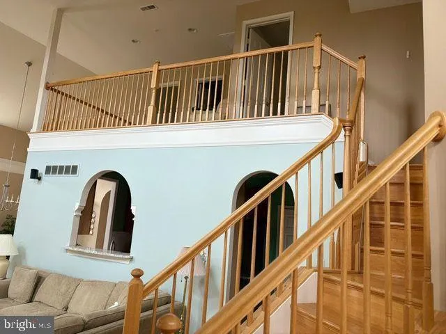 a view of staircase with railing and a stairs