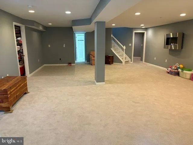an empty room with gym equipment and mirrors