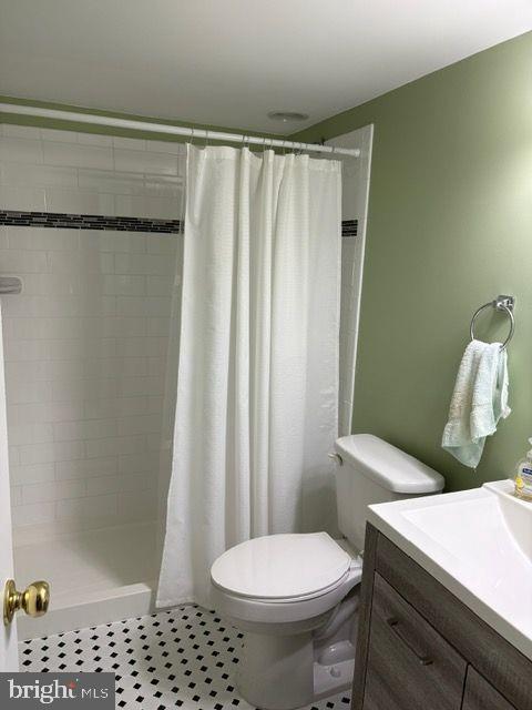 2601 Mill Race Road Frederick, MD 21701 - Photo 34 of 42 a white toilet sitting next to a shower curtain