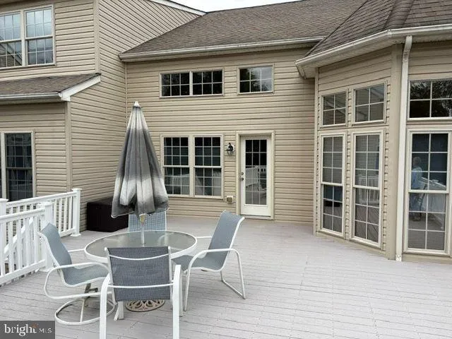 a view of a house with a table and chair