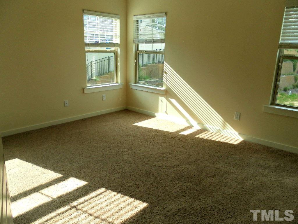 7828 Allscott Way Raleigh, NC 27612 - Photo 13 of 17 a view of an empty room and window